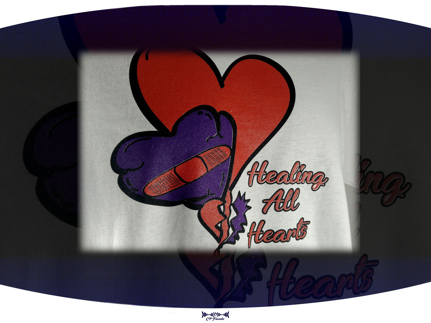 Custom screenprinted white t-shirt with purple and red hearts on the front with the text healing all hearts