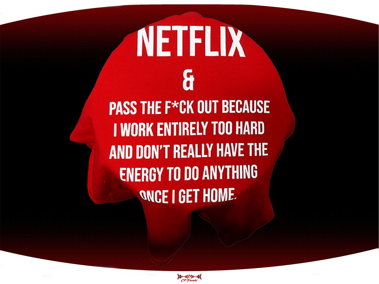 Close up of red screen printed Netflix and chill t-shirt with funny text on the front of it.